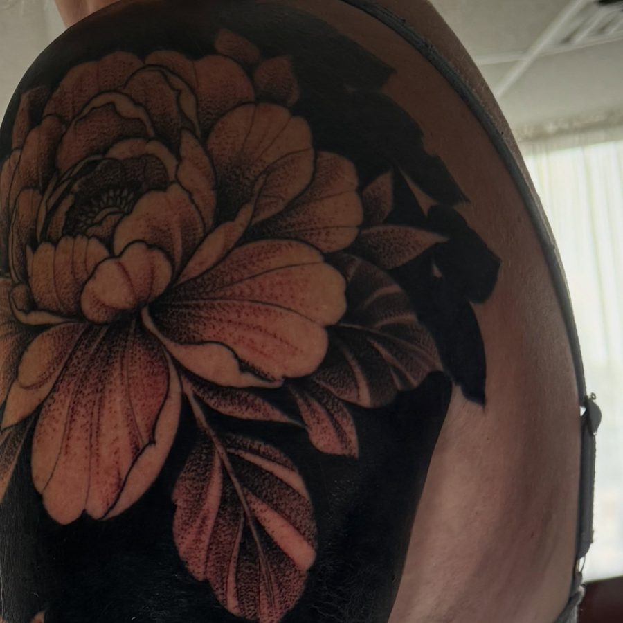Floral blackwork sleeve tattoo by Jeremy Sramek