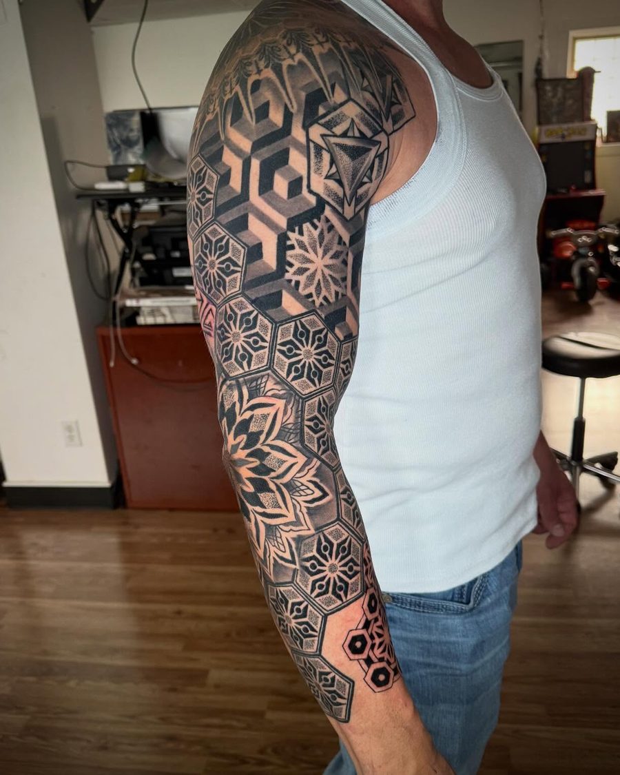 Geometric hexagon blackwork sleeve tattoo by Jeremy Sramek