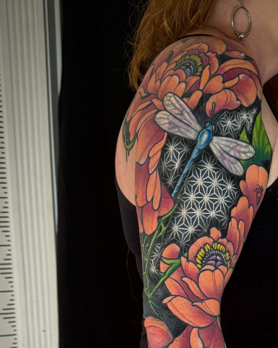 Peonies, a dragonfly and honeycomb: a full color sleeve tattoo by Jeremy Sramek