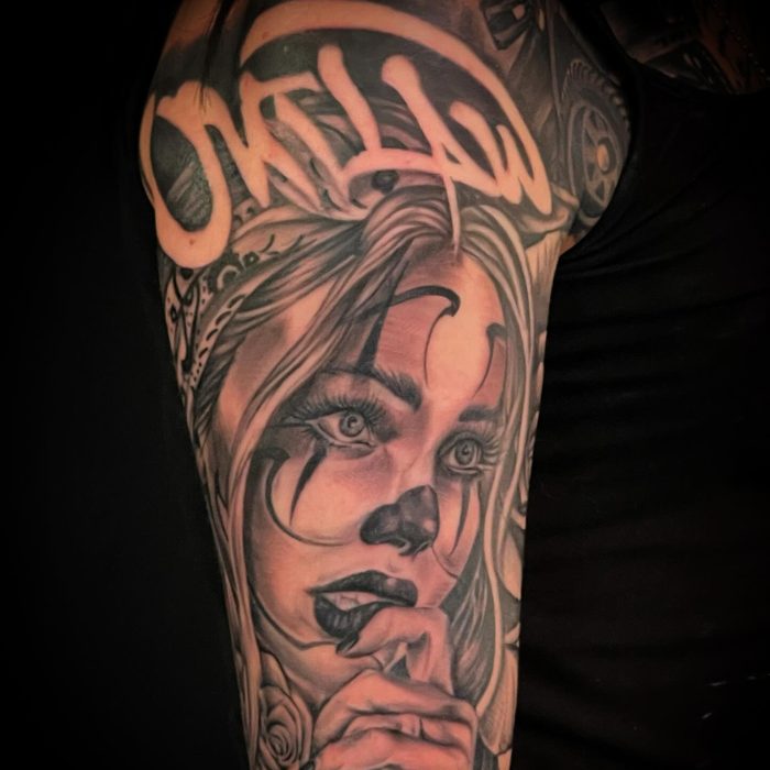 Black and grey realism portrait tattoo by Jeremy Sramek, close up