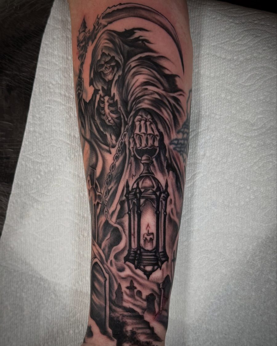 Reaper with a lantern, a black and grey inner forearm tattoo by Jeremy Sramek