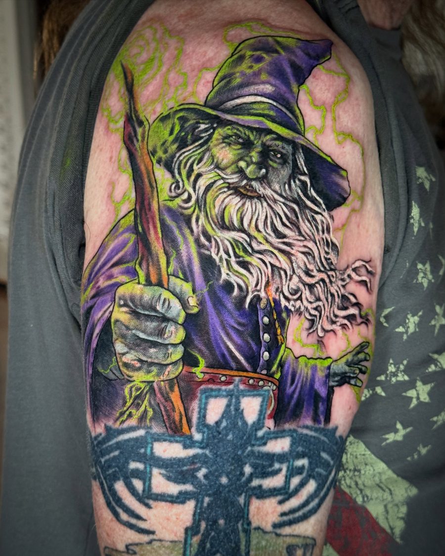 Wizard tattoo in full color on an upper arm by Jeremy Sramek